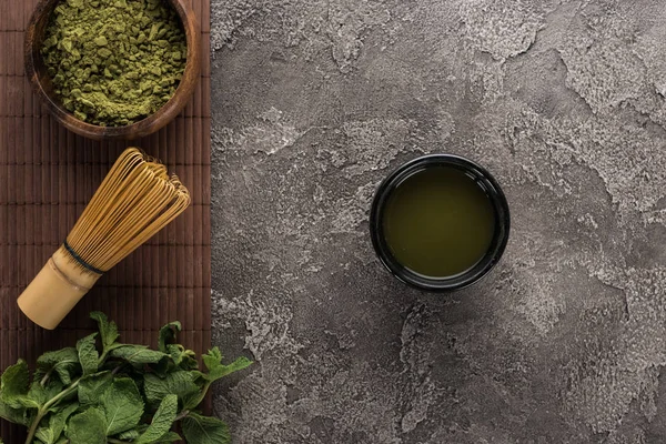 Top View Green Matcha Tea Bamboo Mat Dark Stone Table — Stock Photo, Image