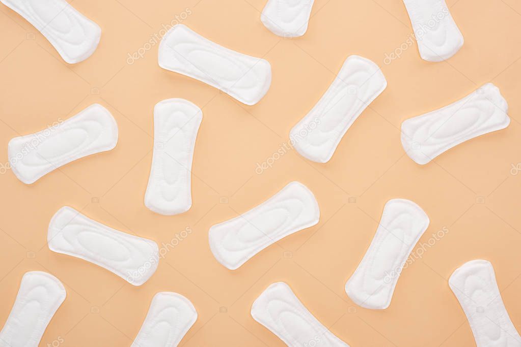 seamless pattern white cotton sanitary napkins isolated on beige