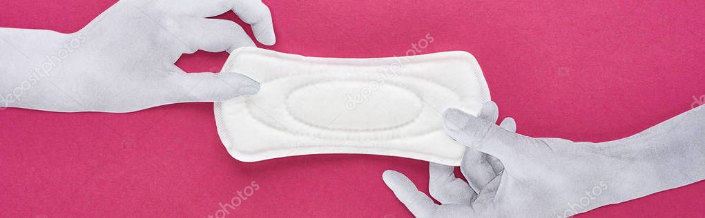 top view of paper cut white hands and white sanitary napkin on purple background, panoramic shot