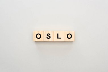top view of wooden blocks with Oslo lettering on white background clipart