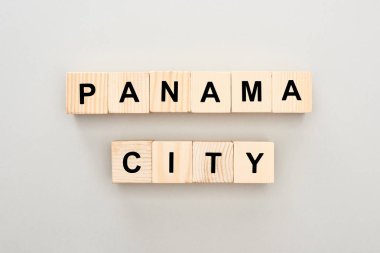 top view of wooden blocks with Panama City lettering on white background clipart
