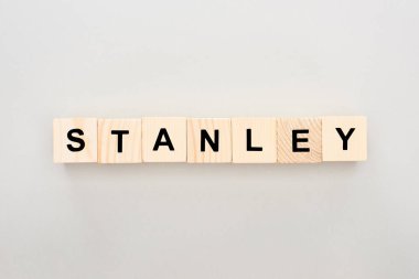 top view of wooden blocks with Stanley lettering on white background clipart