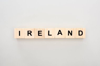top view of wooden blocks with Ireland lettering on white background clipart