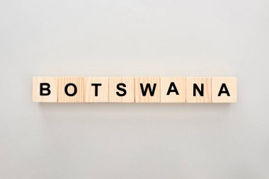 top view of wooden blocks with Botswana lettering on white background clipart