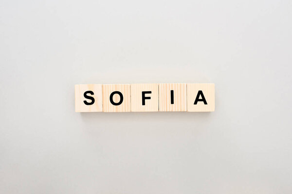 top view of wooden blocks with Sofia lettering on white background