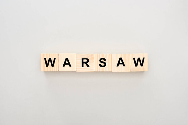 top view of wooden blocks with Warsaw lettering on white background