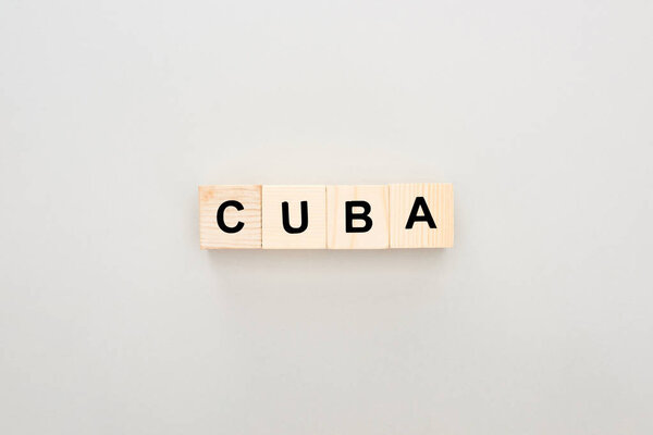 top view of wooden blocks with Cuba lettering on white background