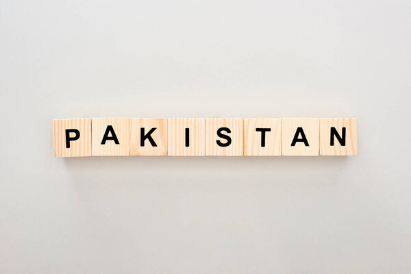 top view of wooden blocks with Pakistan lettering on white background