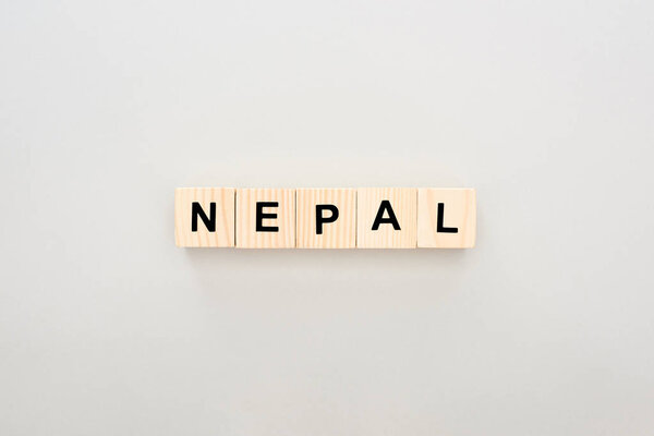 top view of wooden blocks with Nepal lettering on white background