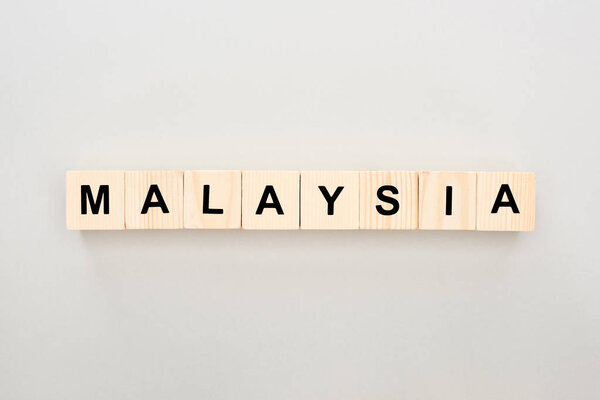 top view of wooden blocks with Malaysia lettering on white background