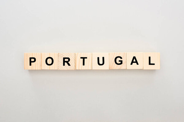 top view of wooden blocks with Portugal lettering on white background