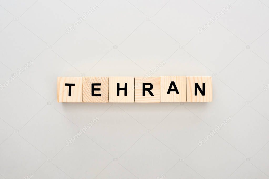 top view of wooden blocks with Tehran lettering on white background