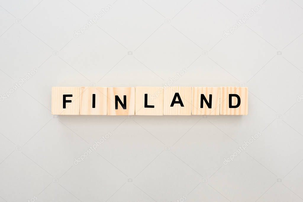 top view of wooden blocks with Finland lettering on white background