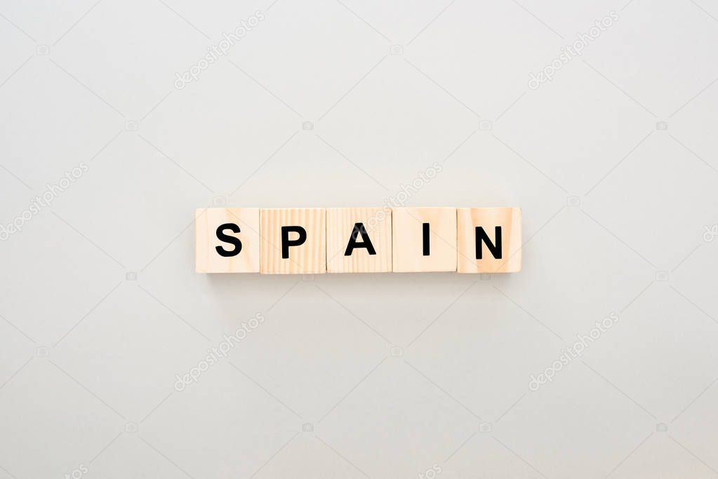 top view of wooden blocks with Spain lettering on white background