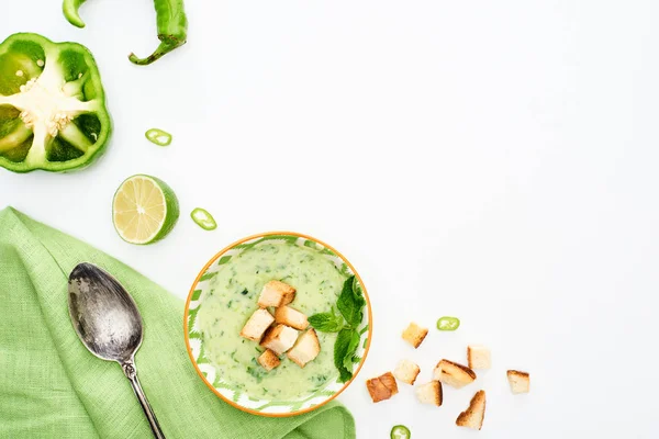 Top view of delicious creamy green vegetable soup served with napkin and spoon isolated on white — Stock Image Top View Delicious Creamy Green Vegetable Soup Served Napkin Spoon Royalty Free Stock Photos