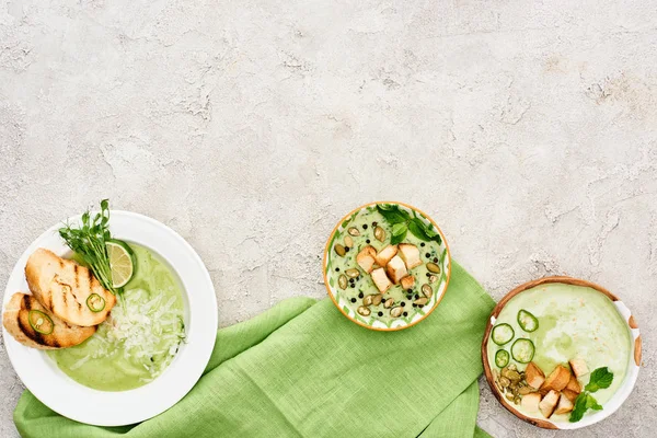 Top view of delicious creamy green soup served with croutons on green napkin — Stock Image Top View Delicious Creamy Green Soup Served Croutons Green Napkin Stock Photo