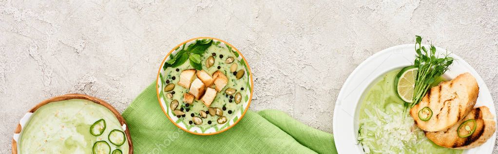 Panoramic shot of delicious creamy green soup served with croutons on green napkin — Stock Image Panoramic Shot Delicious Creamy Green Soup Served Croutons Green Napkin Stock Photo