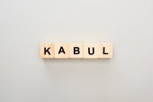 top view of wooden blocks with Kabul lettering on grey background