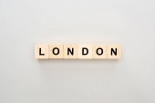 top view of wooden blocks with London lettering on grey background