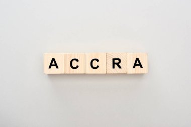 top view of wooden blocks with Accra lettering on grey background clipart