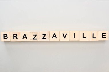 top view of wooden blocks with Brazzaville lettering on grey background clipart