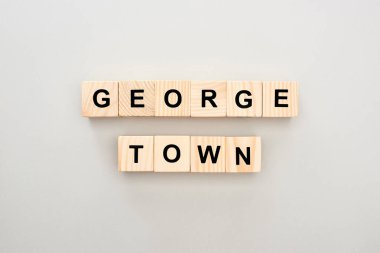 top view of wooden blocks with Georgetown lettering on grey background clipart