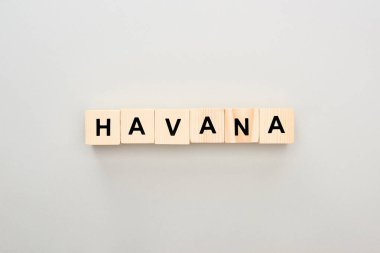 top view of wooden blocks with Havana lettering on grey background clipart