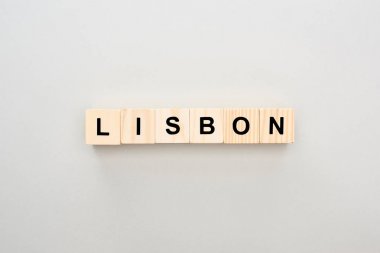 top view of wooden blocks with Lisbon lettering on grey background clipart