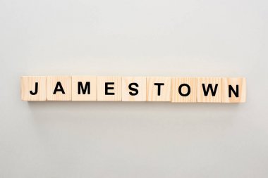 top view of wooden blocks with Jamestown lettering on grey background clipart