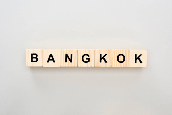 top view of wooden blocks with Bangkok lettering on grey background