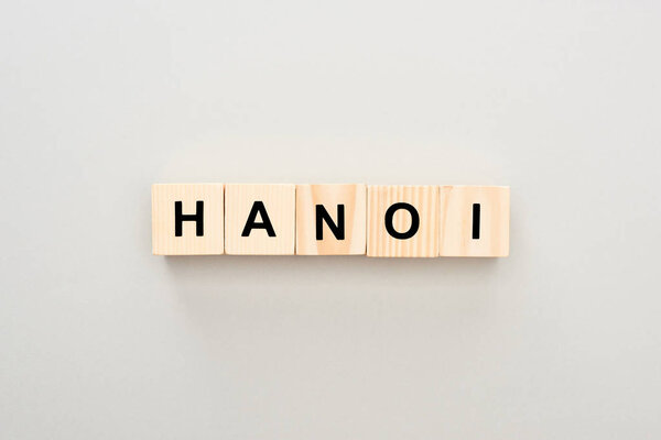 top view of wooden blocks with Hanoi lettering on grey background