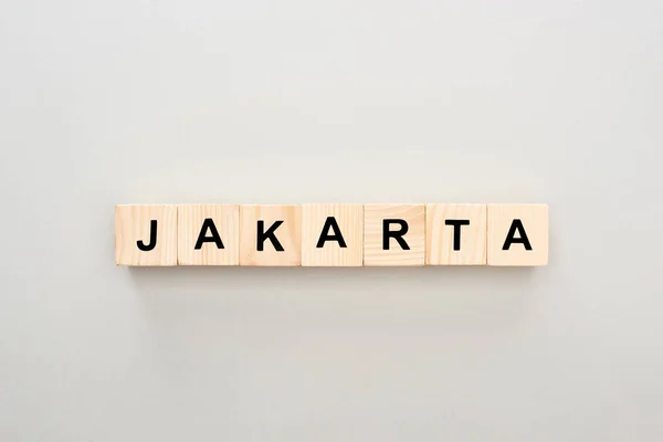 Bovenaanzicht Van Houten Blokken Met Jakarta Belettering Grijze Achtergrond — Stockfoto