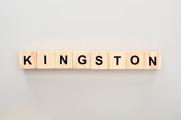 top view of wooden blocks with Kingston lettering on grey background