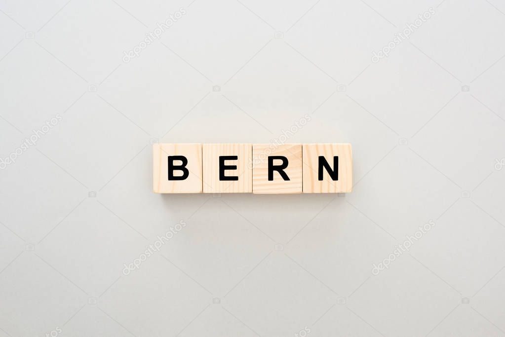 top view of wooden blocks with Bern lettering on grey background