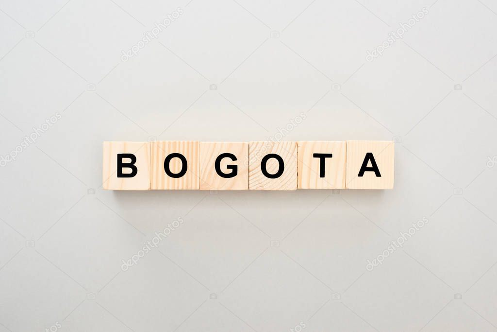 top view of wooden blocks with Bogota lettering on grey background