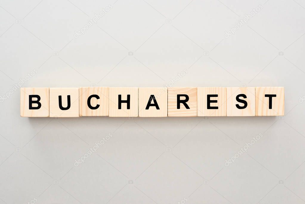 top view of wooden blocks with Bucharest lettering on grey background