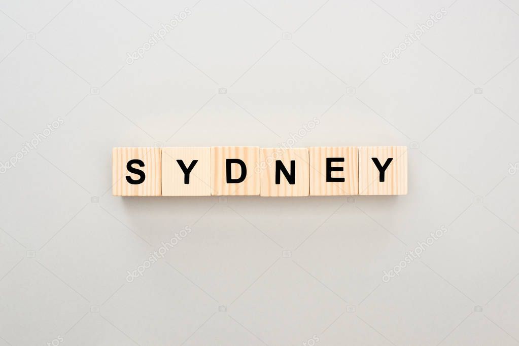 top view of wooden blocks with Sydney lettering on grey background