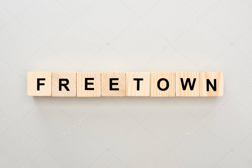 top view of wooden blocks with Freetown lettering on grey background