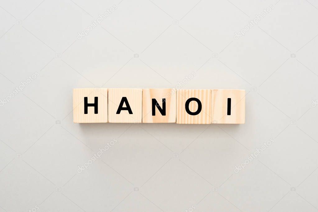 top view of wooden blocks with Hanoi lettering on grey background