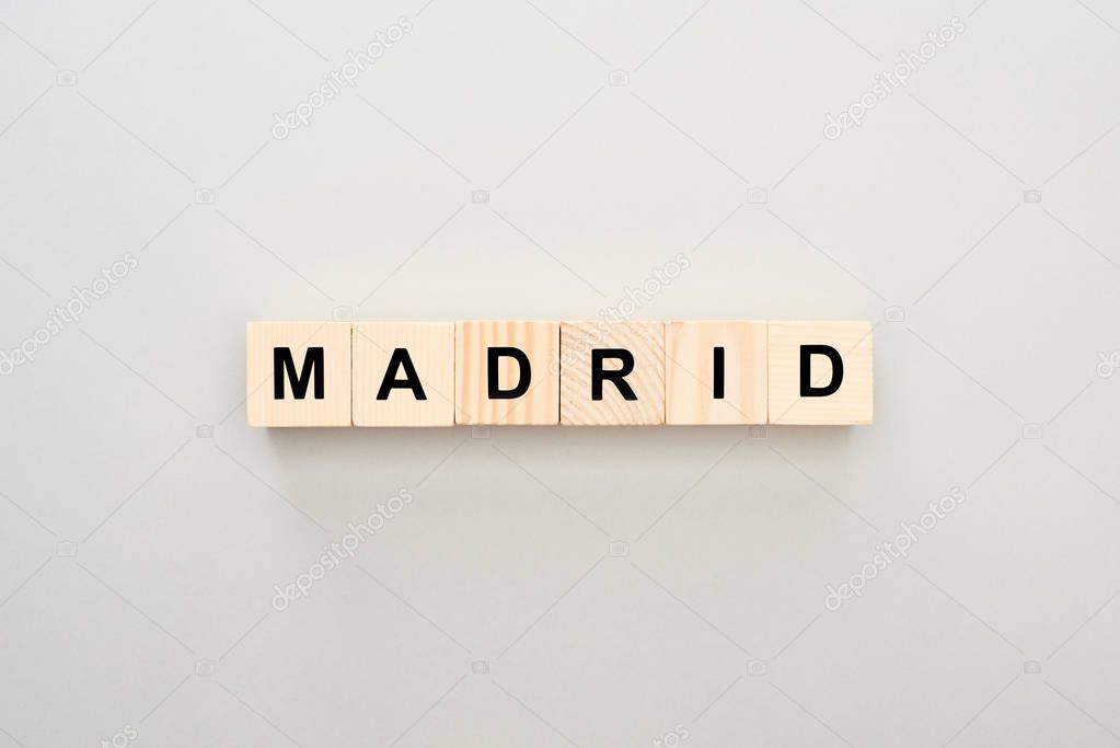 top view of wooden blocks with Madrid lettering on grey background