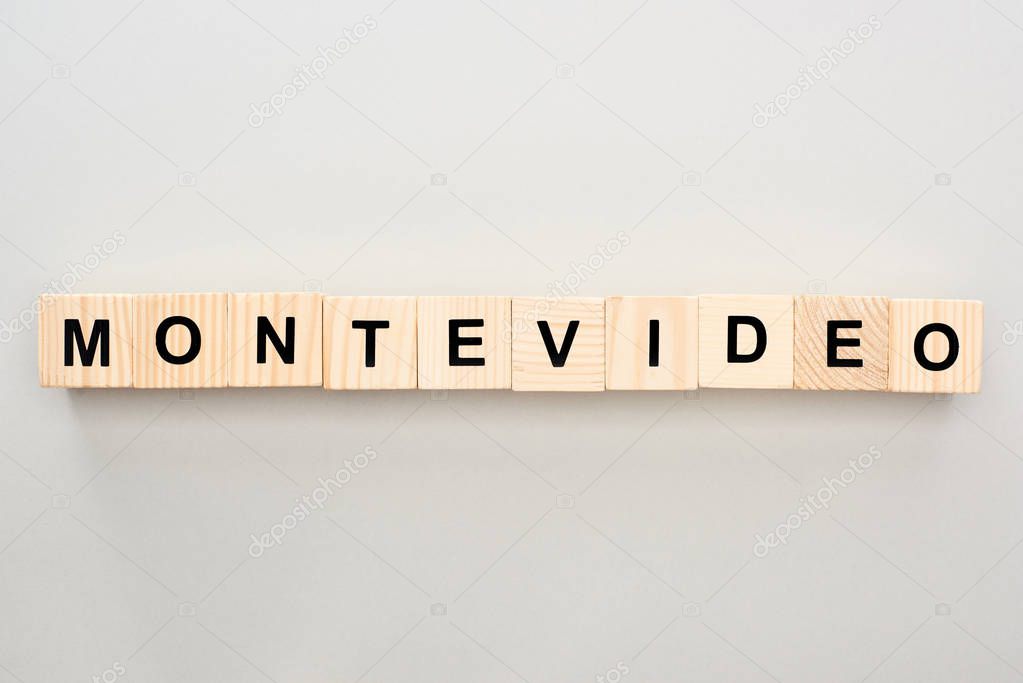 top view of wooden blocks with Montevideo lettering on grey background