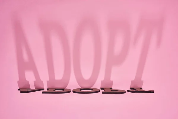 Shadow Word Adopt Pink Background — Stock Photo, Image