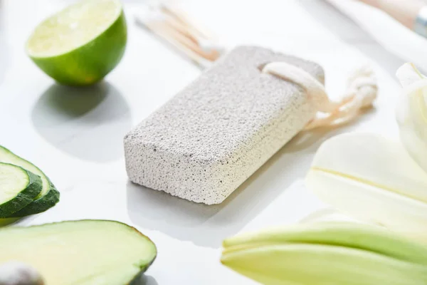 Close View Gray Pumice Stone Fresh Lime Cucumber White Surface — Stock Photo, Image