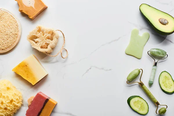 Top View Facial Rollers Loofah Bath Sponges Cucumber Avocado Marble — Stock Photo, Image