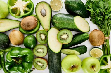 top view of apples, avocados, cucumbers, limes, peppers, kiwi, greenery and zucchini clipart
