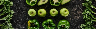 panoramic shot of fresh apples, peppers, avocados and greenery  clipart