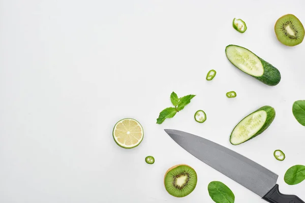 Top View Knife Fresh Cucumbers Kiwi Lime Peppers Greenery — Stock Photo, Image