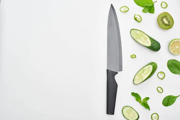 Top View Knife Fresh Cucumbers Kiwi Lime Peppers Greenery — Stock Photo, Image
