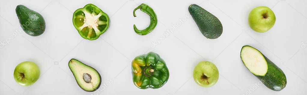 panoramic shot of fresh and green apples, peppers and avocados 