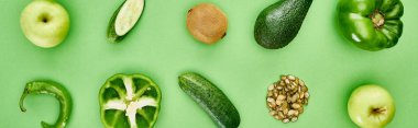 panoramic shot of peppers, cucumbers, kiwi, apples, pumpkin seeds and avocado clipart